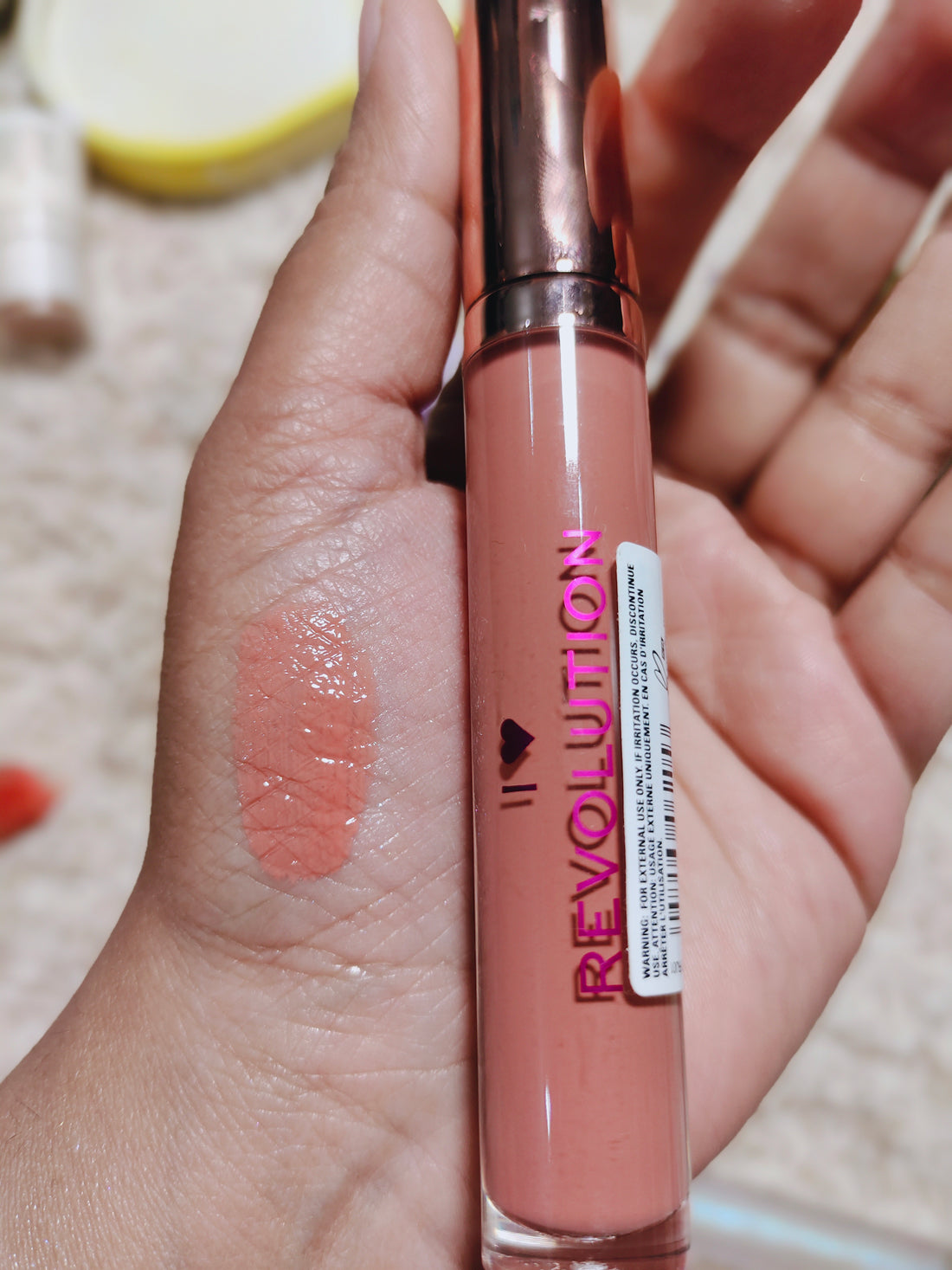 Revolution lip gloss chocolate orange shade.