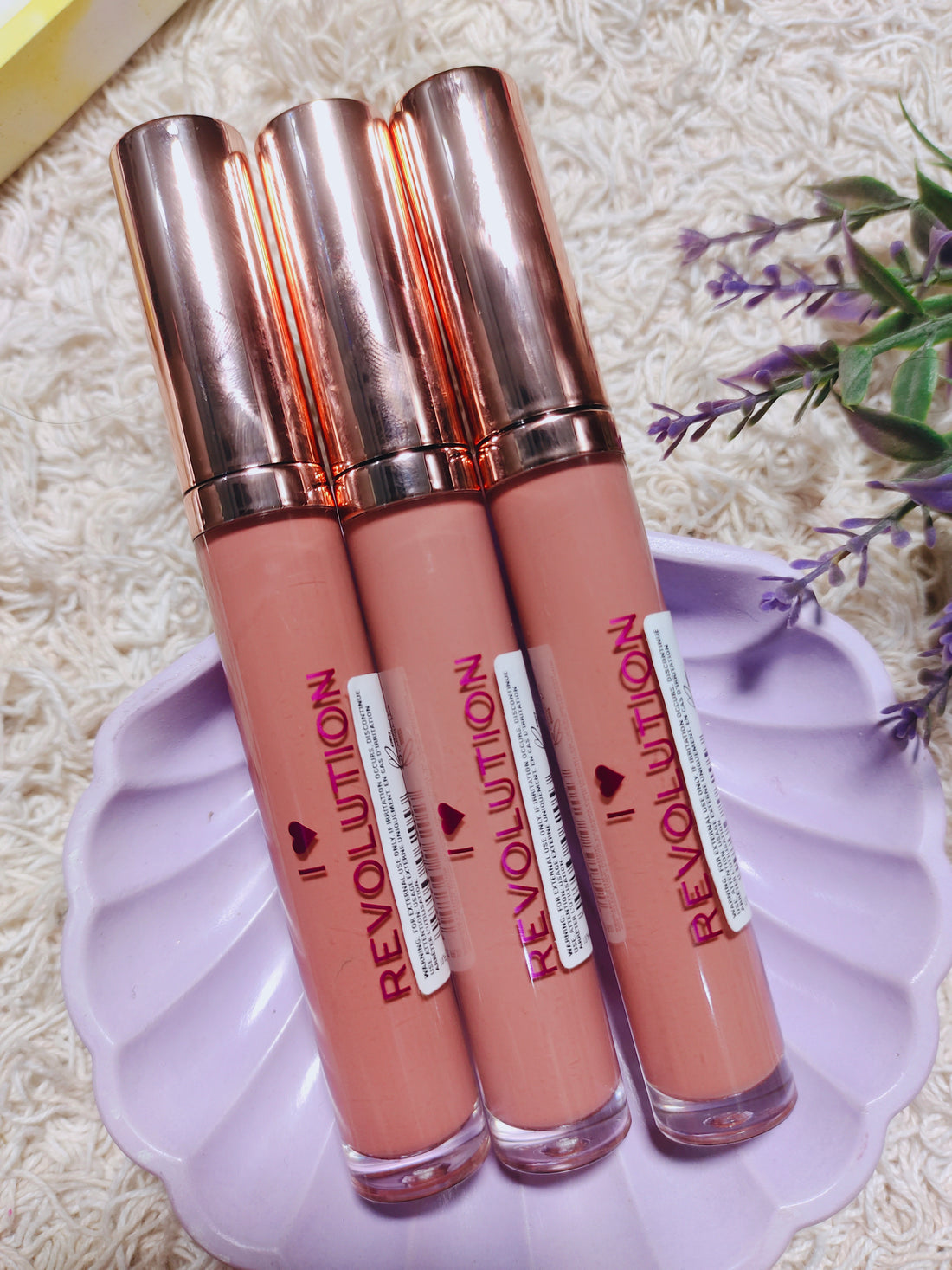 Revolution lip gloss chocolate orange shade.