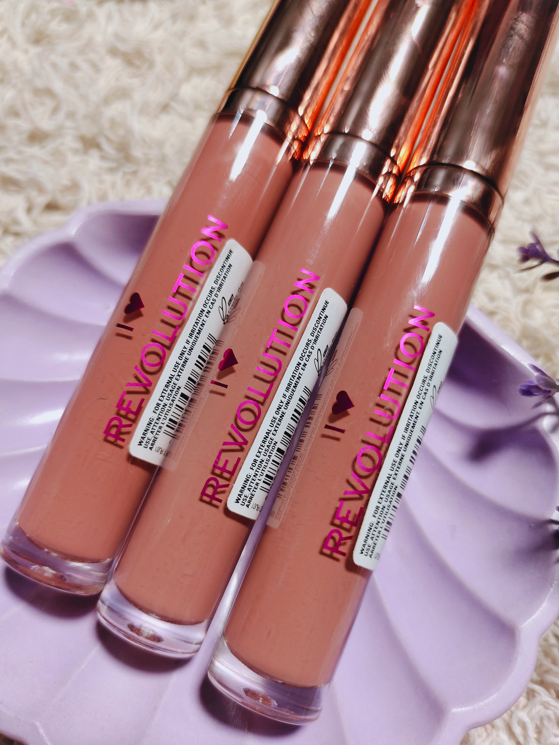 Revolution lip gloss chocolate orange shade.