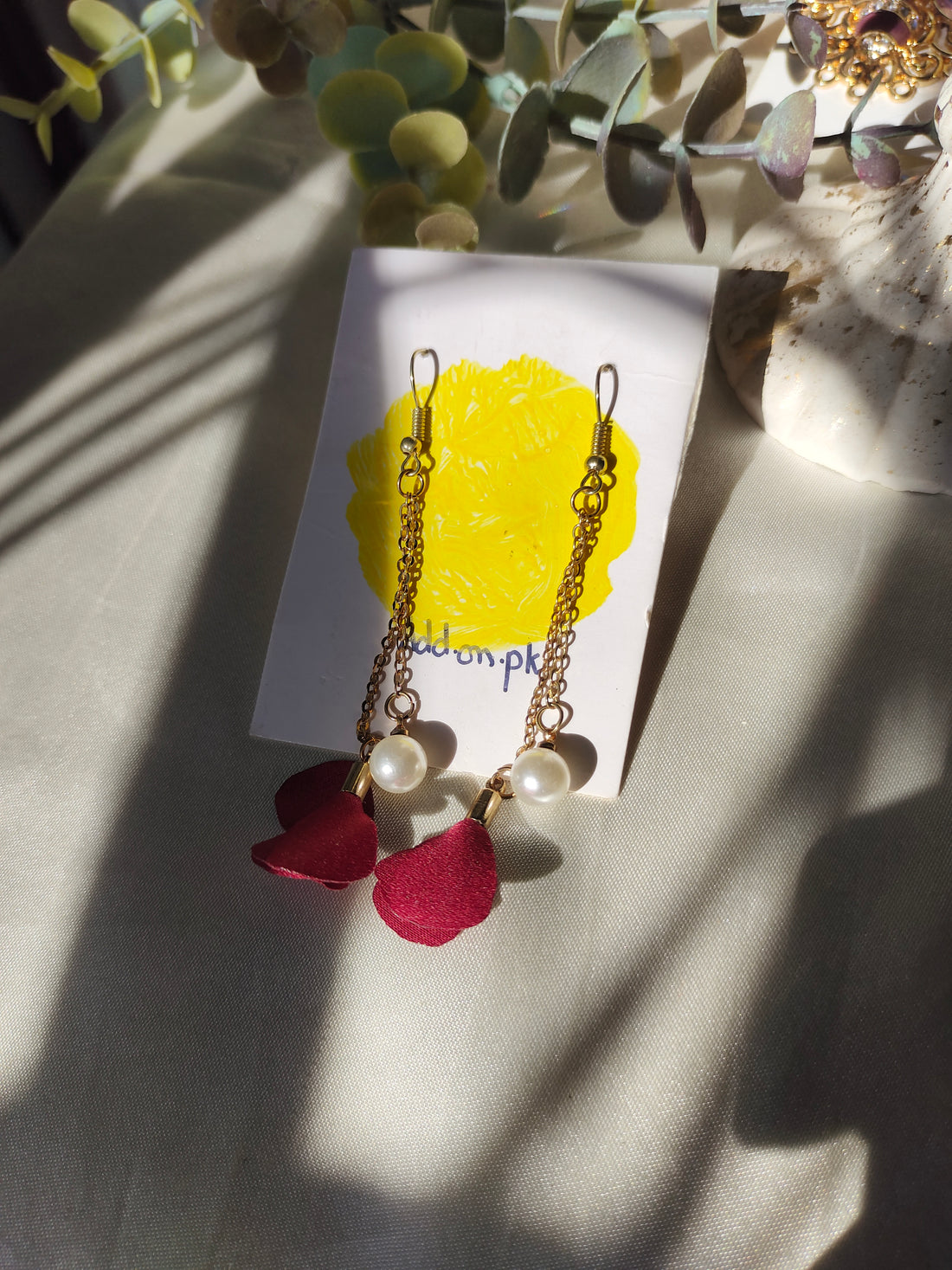 Gold and red long earrings